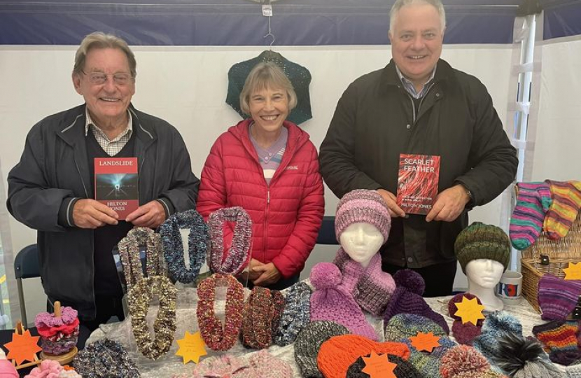 Simon Baynes MP with Rosemary and Peter at their market stall
