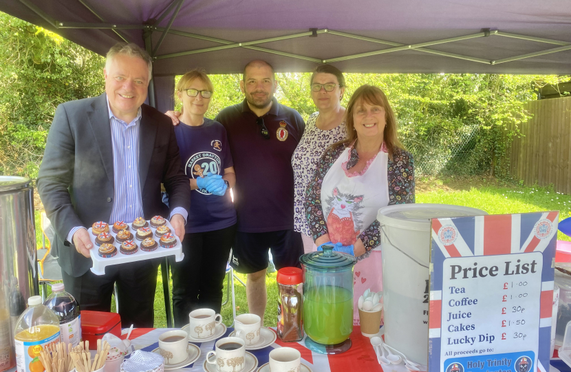 Simon Baynes MP at the refreshment stand at the Coronation Picnic in the Park in Bronington