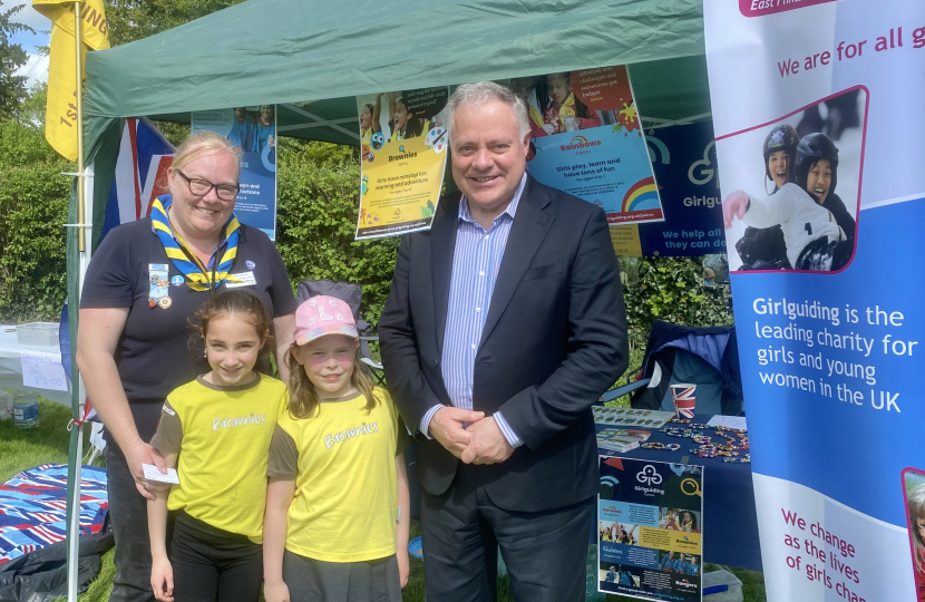 Simon Baynes MP with the 1st Bronington Brownies at the Coronation Picnic in the Park in Bronington
