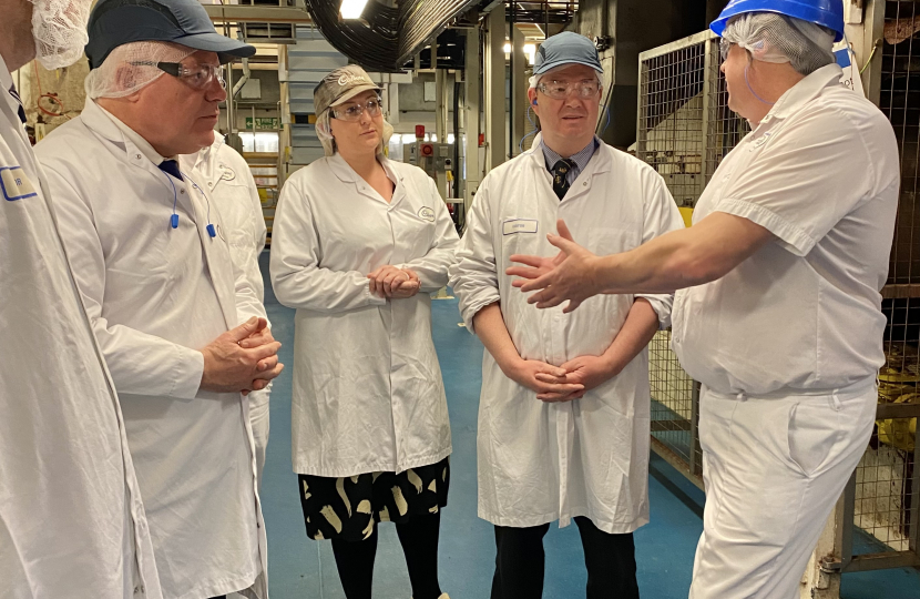 Simon Baynes MP, Amy Berry (Feedstocks Quality Manager), Minister for Employment and Phil Davies (Site Operations Lead) at Mondelez in Chirk